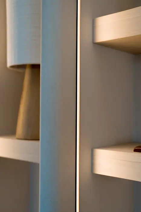 Bespoke cabinet against a seamlessly finished wall — Luxhome showroom